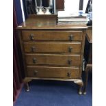 AN OAK FOUR DRAWER CHEST AND A MATCHING CHEST