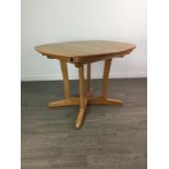 AN ERCOL MANTUA PEDESTAL EXTENDING DINING TABLE