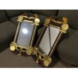 A PAIR OF REPRODUCTION PAINTED WALL MIRRORS,