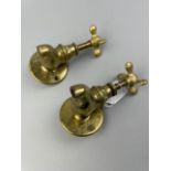 A PAIR OF BRASS TAPS