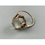 A GEMSTONE SET NINE CARAT GOLD RING