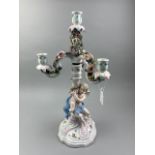 A CONTINENTAL CERAMIC CANDELABRUM IN THE STYLE OF MEISSEN