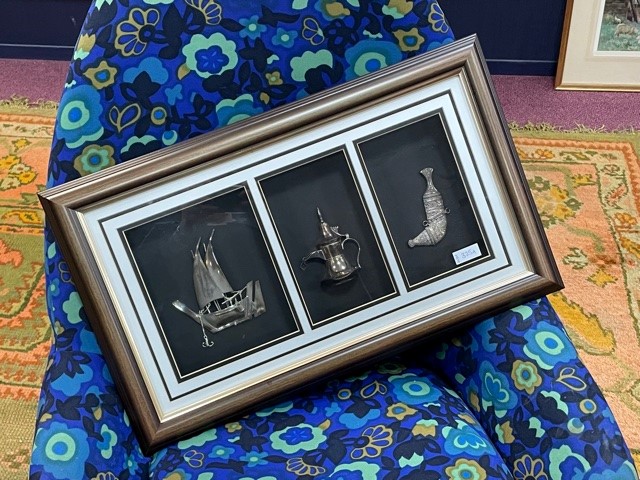 A FRAMED GROUP OF SILVER DHOW, EWER AND DAGGER