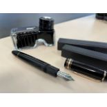 A MONT BLANC FOUNTAIN PEN AND INKWELL