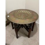 AN INDIAN FOLDING OCCASIONAL TABLE