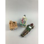 A WOODEN MUSICAL TOY TRAIN ON TRACK ALONG WITH TWO OTHER TOYS