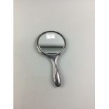 A SILVER BACKED HAND MIRROR