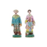 A PAIR OF MID-19TH CENTURY CONTINENTAL PORCELAIN FIGURAL TAPERSTICKS