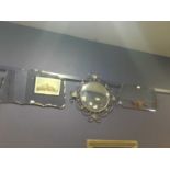 A RETRO CIRCULAR WALL MIRROR AND TWO OTHERS