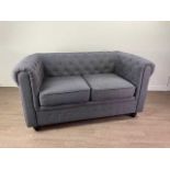 A MODERN GRAY TWO SEAT BUTTON BACK SETTEE