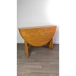 AN ERCOL DROP LEAF DINING TABLE