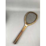 AN EARLY 20TH CENTURY TENNIS RACKET