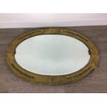 AN OVAL WALL MIRROR, ANOTHER MIRROR AND TWO TEA TRAYS