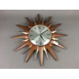 A RETRO STARBURST QUARTZ WALL CLOCK BY METAMEC