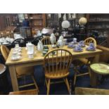 A MODERN PINE KITCHEN TABLE AND FOUR CHAIRS