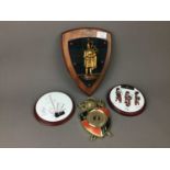 A WALL HANGING MCLEOD SHIELD, SHIELD SHAPED BAROMETER, DOOR STOP AND OTHER OBJECTS