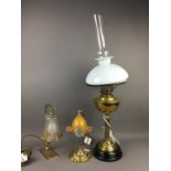 A BRASS OIL LAMP AND TWO BRASS DESK LAMPS