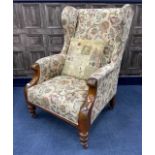 AN VICTORIAN UPHOLSTERED WING BACK ARMCHAIR