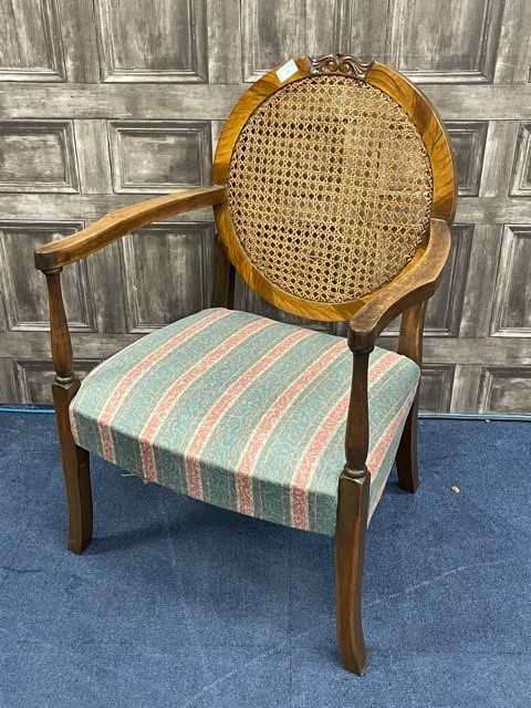 A WALNUT CANE BACK ARMCHAIR