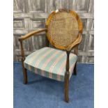 A WALNUT CANE BACK ARMCHAIR