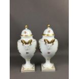 A PAIR OF KAISER PORCELAIN URN SHAPED VASES AND COVERS
