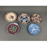 AN IMARI PLAQUE AND A GROUP OF ASIAN DECORATIVE PLATES