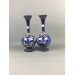 A PAIR OF LATE VICTORIAN BLUE AND GILT CIRCULAR VASES