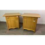 A PAIR OF OAK BEDSIDE CUPBOARDS