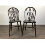 A SET OF SIX WHEEL BACKED DINING CHAIRS