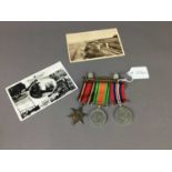 A FRAMED GILDER PILOT PLAQUE, MEDALS AND VINTAGE POSTCARDS