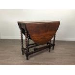 AN EARLY 20TH CENTURY OAK DROP LEAF OVAL DINING TABLE