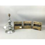 A SET OF THREE VICTORIAN BRASS WALL MOUNTING ASH TRAYS AND A TABLE LAMP