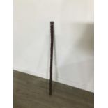 A CARVED WOOD WALKING STICK/FLASK