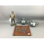 A SPELTER FIGURE OF THE WHISTLING BOY, TEA POTS AND OTHER OBJECTS