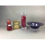 A COLLECTION OF ART GLASS ALONG WITH A WINE BOTTLE HOLDER AND A BRASS CARRIAGE CLOCK