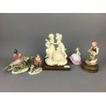 A COLLECTION OF RESIN AND CERAMICS FIGURES