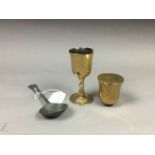 A PAIR OF 19TH CENTURY BRONZE COMMUNION CUPS AND PEWTER SPPON
