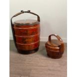 A CHINESE LACQUERED CYLINDRICAL PICNIC BOX AND A SMALLER ONE