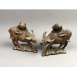 A PAIR OF EARLY 20TH CENTURY CHINESE CARVED WATER BUFFALOS AND RIDERS