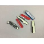 A LOT OF THREE VICTORINOX SWISS ARMY KNIVES ALONG WITH THREE MULTI TOOL KNIVES