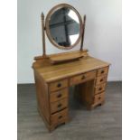 AN EDWARDIAN OAK THREE DOOR WARDROBE, DRESSING CHEST AND TWO CHAIRS