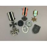 A GROUP OF THIRD REICH-TYPE BADGES AND MEDALS