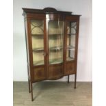 AN EDWARDIAN MAHOGANY BOW-FRONTED DISPLAY CABINET