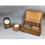 A COROMANDEL LAP DESK, MANTEL CLOCK, WOOD CASKET AND BAROMETER