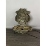 A WALL MOUNTING SIMULATED STONE GARDEN WATER FEATURE