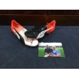 A PAIR OF SIGNED FOOTBALL BOOTS
