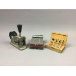 A VINTAGE LIGHTNING BUTTERFLY LABELLING MACHINE