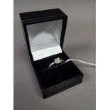 A DIAMOND SOLITAIRE RING SET IN NINE CARAT GOLD