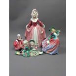 A ROYAL DOULTON FIGURE OF 'AUTUMN BREEZES' ALONG WITH FOUR OTHER CERAMIC FIGURES