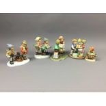 A COLLECTION OF TWELVE HUMMEL FIGURES